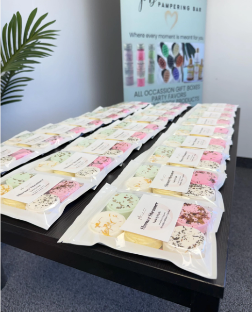 Display of individually packaged Pampering Bar shower steamers for gifts and party favors