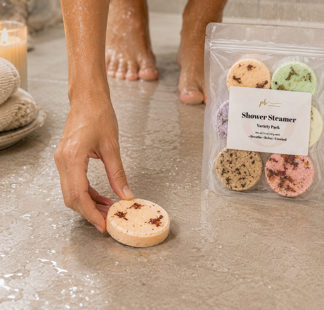 Woman placing a Pampering Bar aromatherapy shower steamer on the shower floor